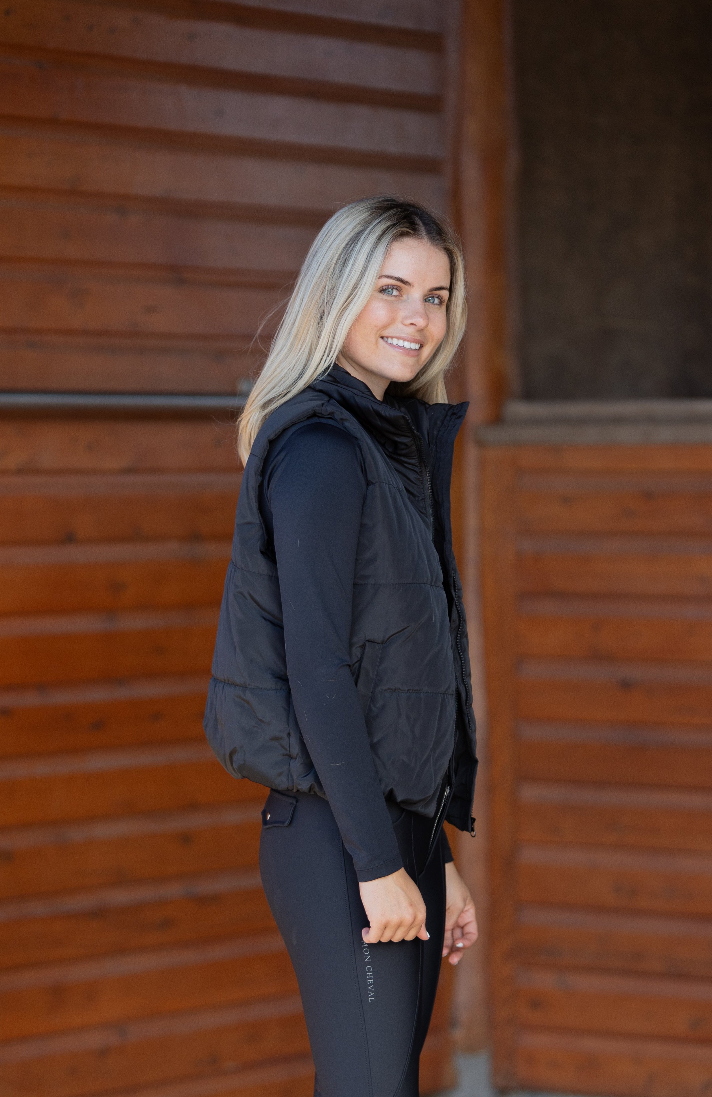 Women's Equestrian classic black puffer vest with embroidered logo details and elastic hem for flattering fit