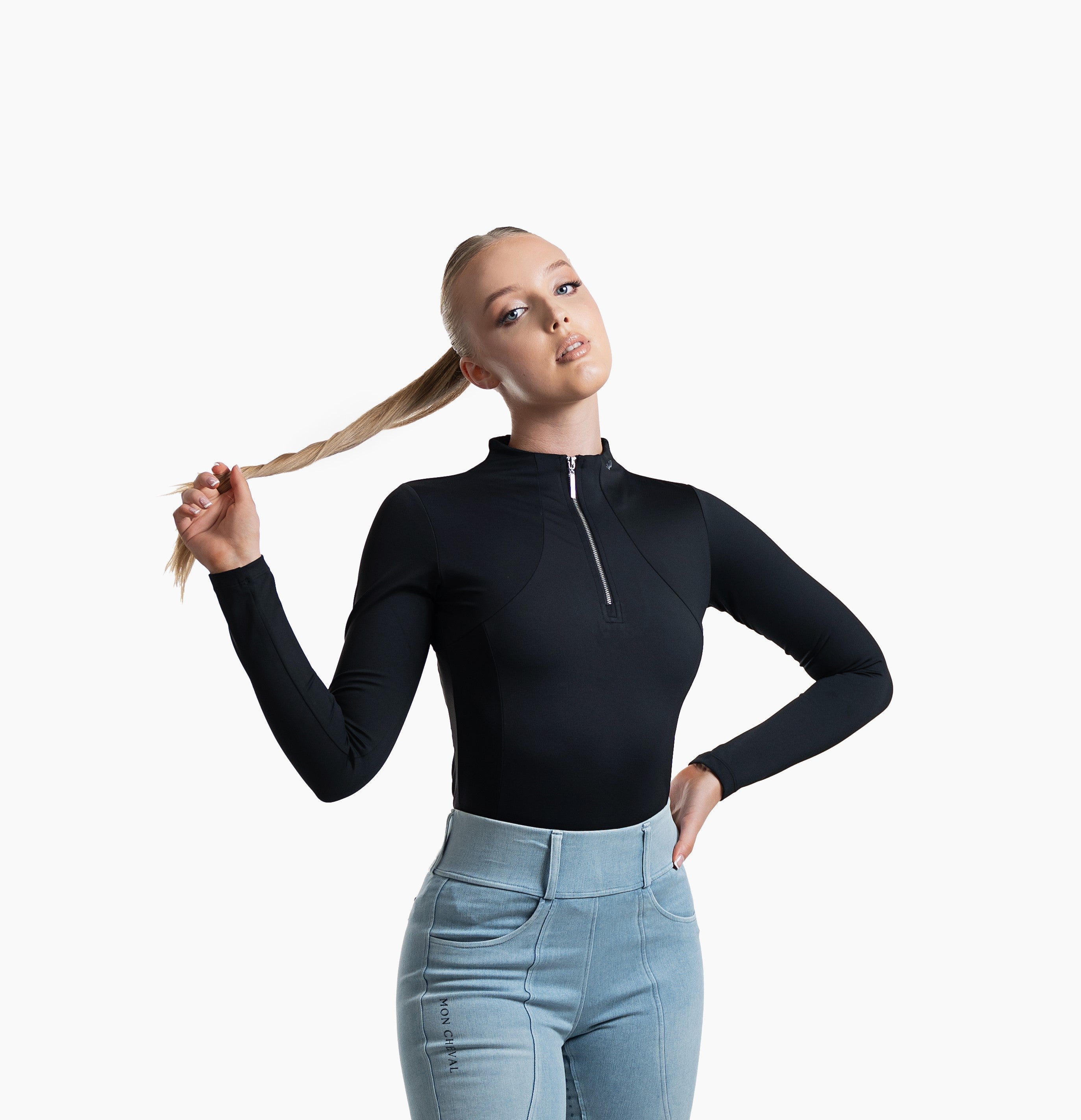 Women's Equestrian long sleeve baselayer in black with classic logo details, flattering fit and silver metal zipper for versatility
